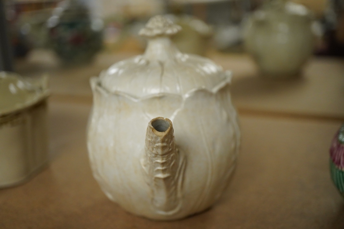 A rare Staffordshire saltglaze stoneware teapot, mid 18th century, an early 19th Wedgwood stoneware teapot and a stoneware butter tub and cover - 13cm wide (3)